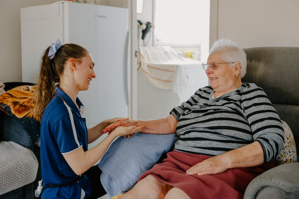 Taking Care Mobile Massage Female Therapist with Senior Elderly Client in Melbourne Brisbane Sydney
